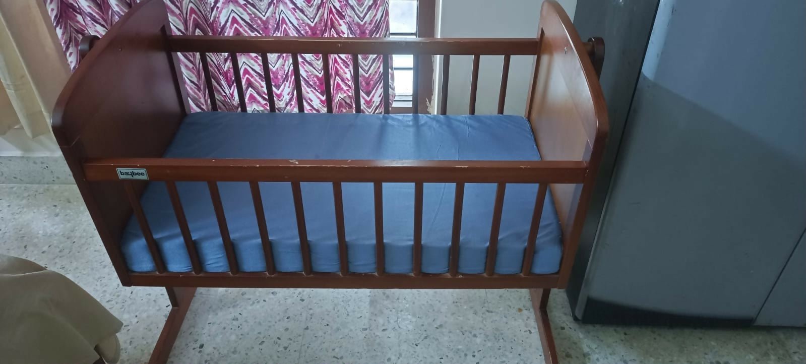 BAYBEE 2-in-1 Wooden Cradle for Newborn Baby with sturdy wooden construction, gentle rocking function, convertible design, breathable sleeping area, and secure frame for safe and comfortable newborn rest.
