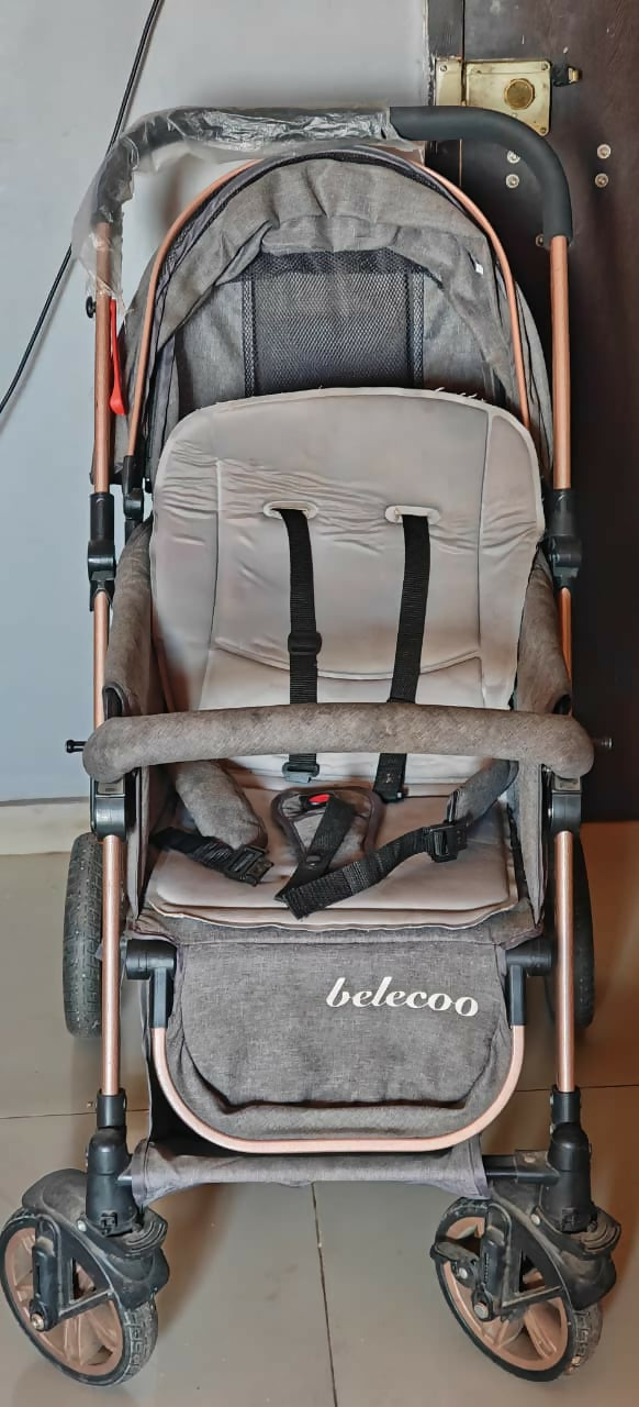 BELCO Baby Stroller/Pram in Almost New condition featuring comfortable seating, protective canopy, safety harness, smooth-moving wheels, and a practical design for everyday walks, shopping, and outings with your baby.