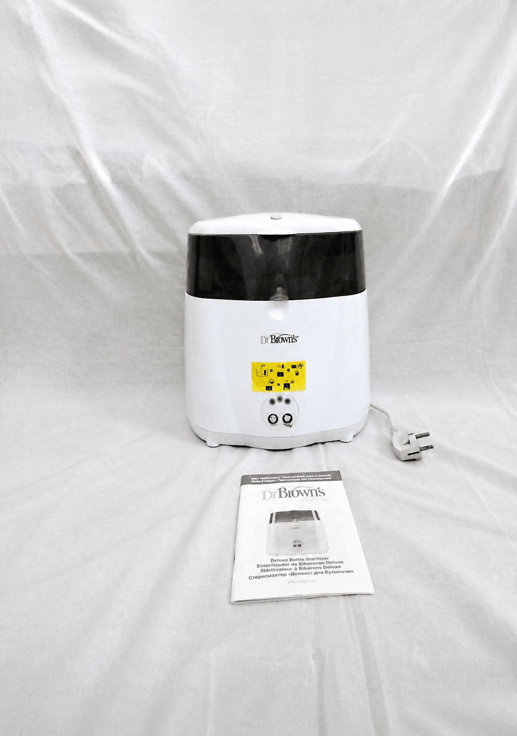 Dr. Brown's Deluxe electric steam bottle sterilizer with BPA-free construction, 6-bottle capacity, and spacious compartments for bottles, nipples, pacifiers, and baby feeding accessories.