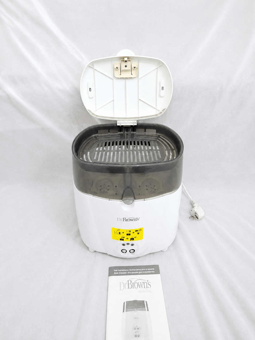 Dr. Brown's Deluxe electric steam bottle sterilizer with BPA-free construction, 6-bottle capacity, and spacious compartments for bottles, nipples, pacifiers, and baby feeding accessories.