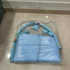 Baby bed with hanging toys featuring a soft cushioned asleeping area, protective sides, and colorful hanging toys to keep babies comfortable, engaged, and entertained.
