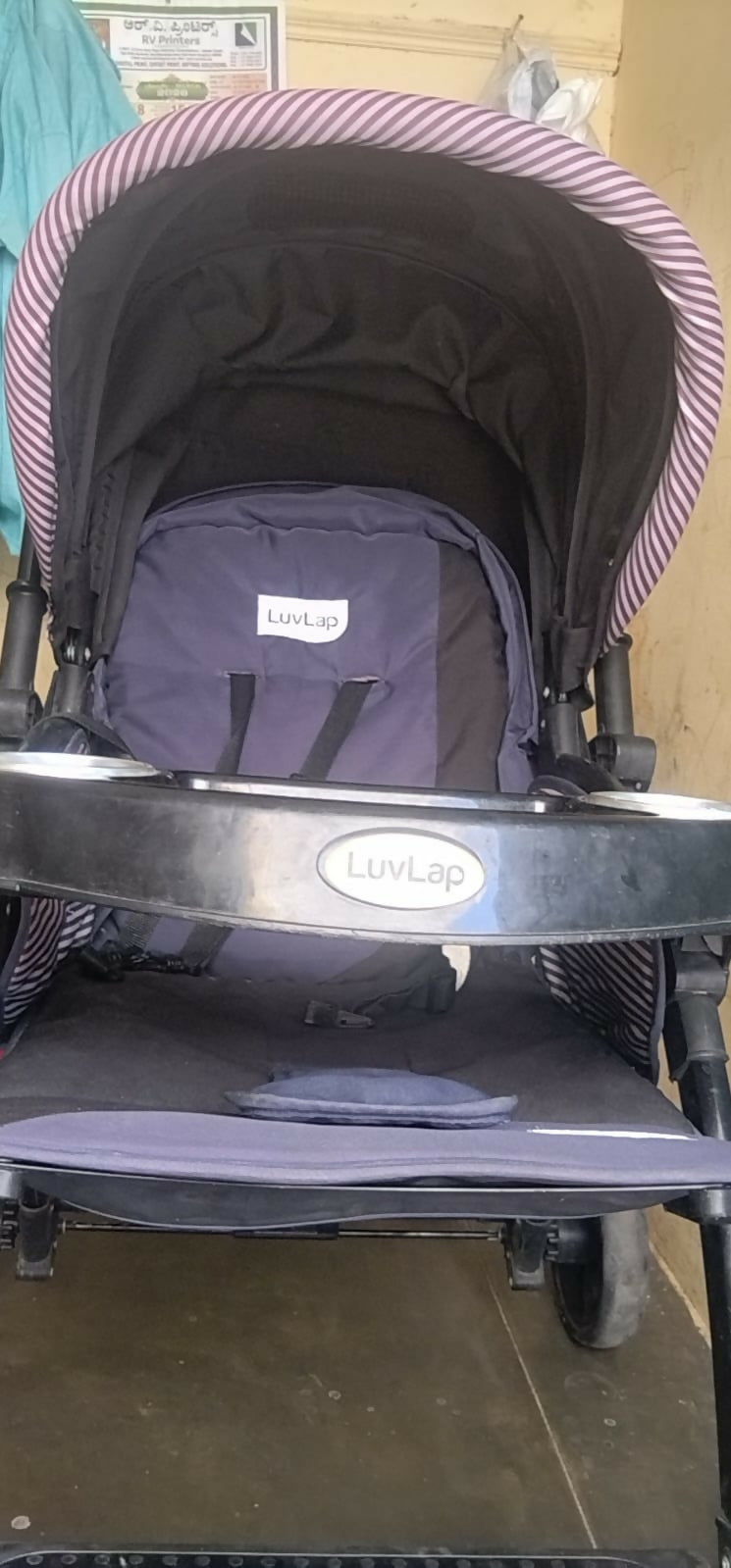 LuvLap stroller/pram with a reclining seat, 5-point safety harness, adjustable canopy, smooth wheels, spacious storage basket, and a lightweight foldable design for everyday outings.
