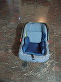 Baby Carry Cot in Almost New condition featuring comfortable padded seating, a convenient carry handle and a practical portable design for carrying and supervised resting of your baby.