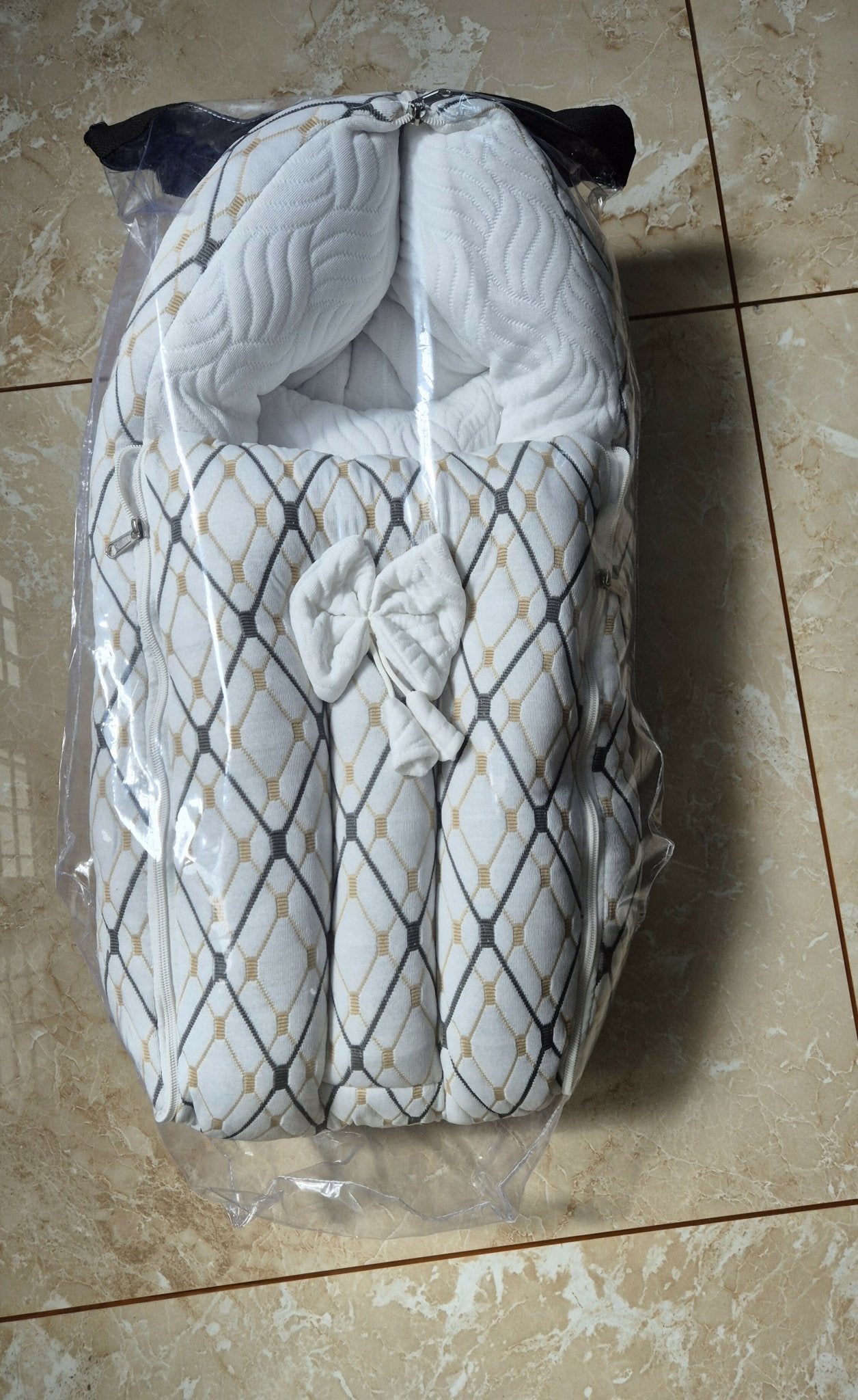 Baby carry nest and sleeping bag with soft cushioned padding, cozy wrap design, secure carry handles, and breathable fabric to keep newborns warm, comfortable, and protected during sleep and travel.