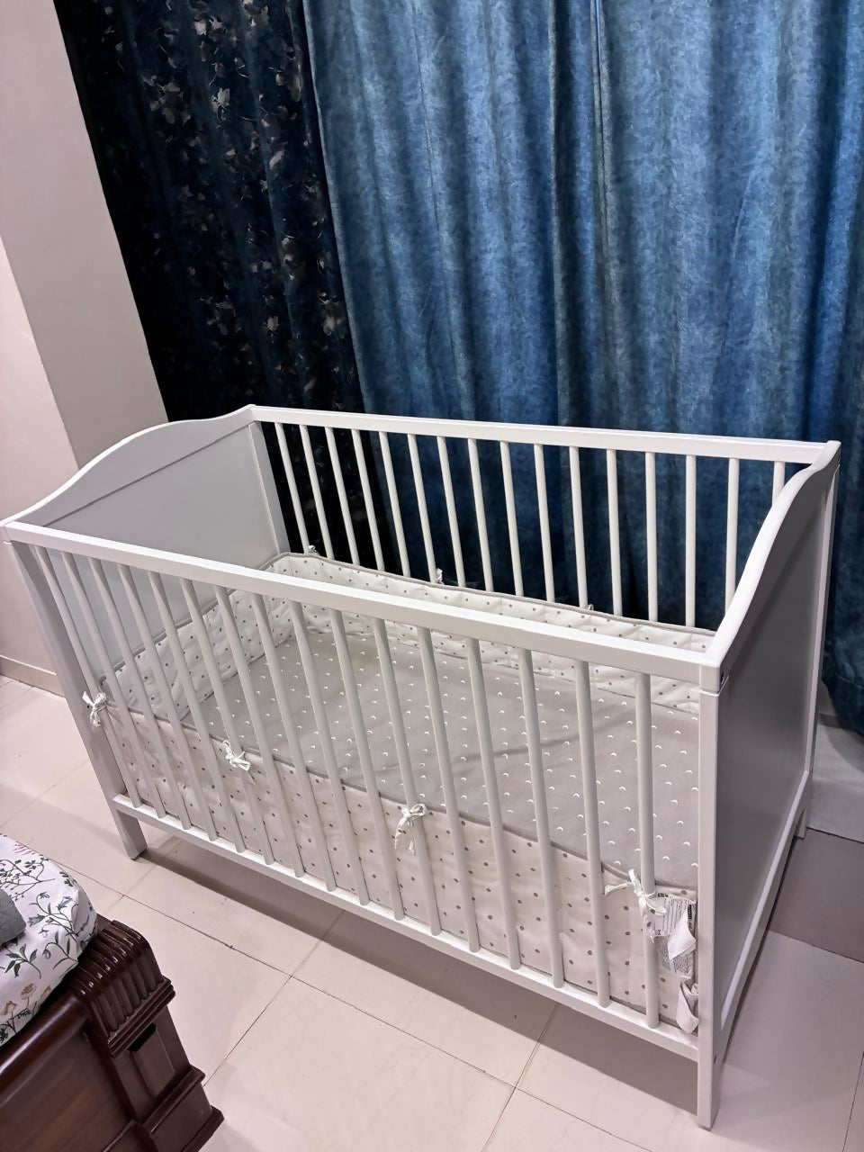IKEA Baby Cot measuring 60 × 120 cm (23 5/8 × 47 1/4 inches), featuring a simple, practical design with protective side rails and a spacious sleeping area for babies.
