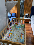 BABYHUG Baby Cot Cum Rocker with Mattress in Some Used condition featuring a versatile cot and rocking design, comfortable mattress, sturdy frame, and protective side rails for baby's everyday rest and relaxation.