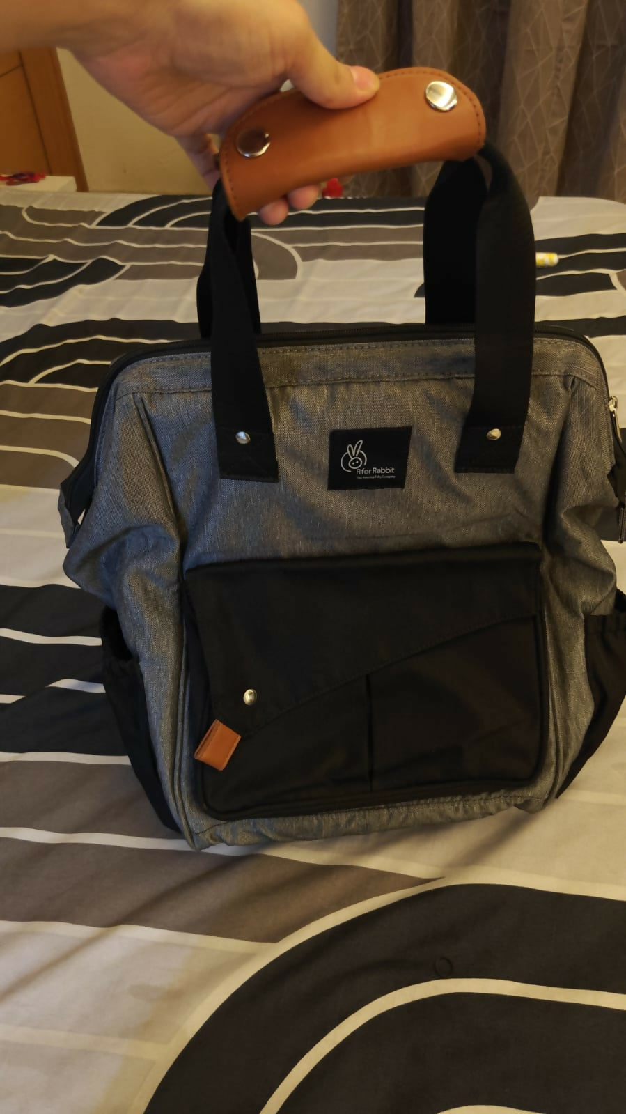 R for Rabbit Caramello Delight diaper bag for moms with multiple storage compartments, spacious design, comfortable carrying straps, and organized space for baby essentials.