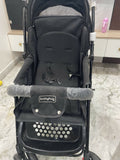 Evenflo travel system with baby stroller and infant car seat, featuring a foldable design, reclining seat, adjustable canopy, 5-point safety harness, and spacious storage basket for convenient travel.