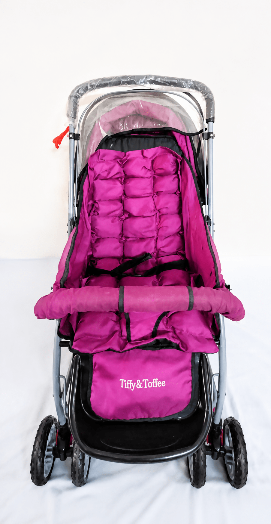 Tiffy & Toffee Maxtrem baby stroller with reversible handle, reclining seat, foldable travel pram design, adjustable canopy, 5-point safety harness, smooth wheels, and storage basket for babies and toddlers up to 22 kg.