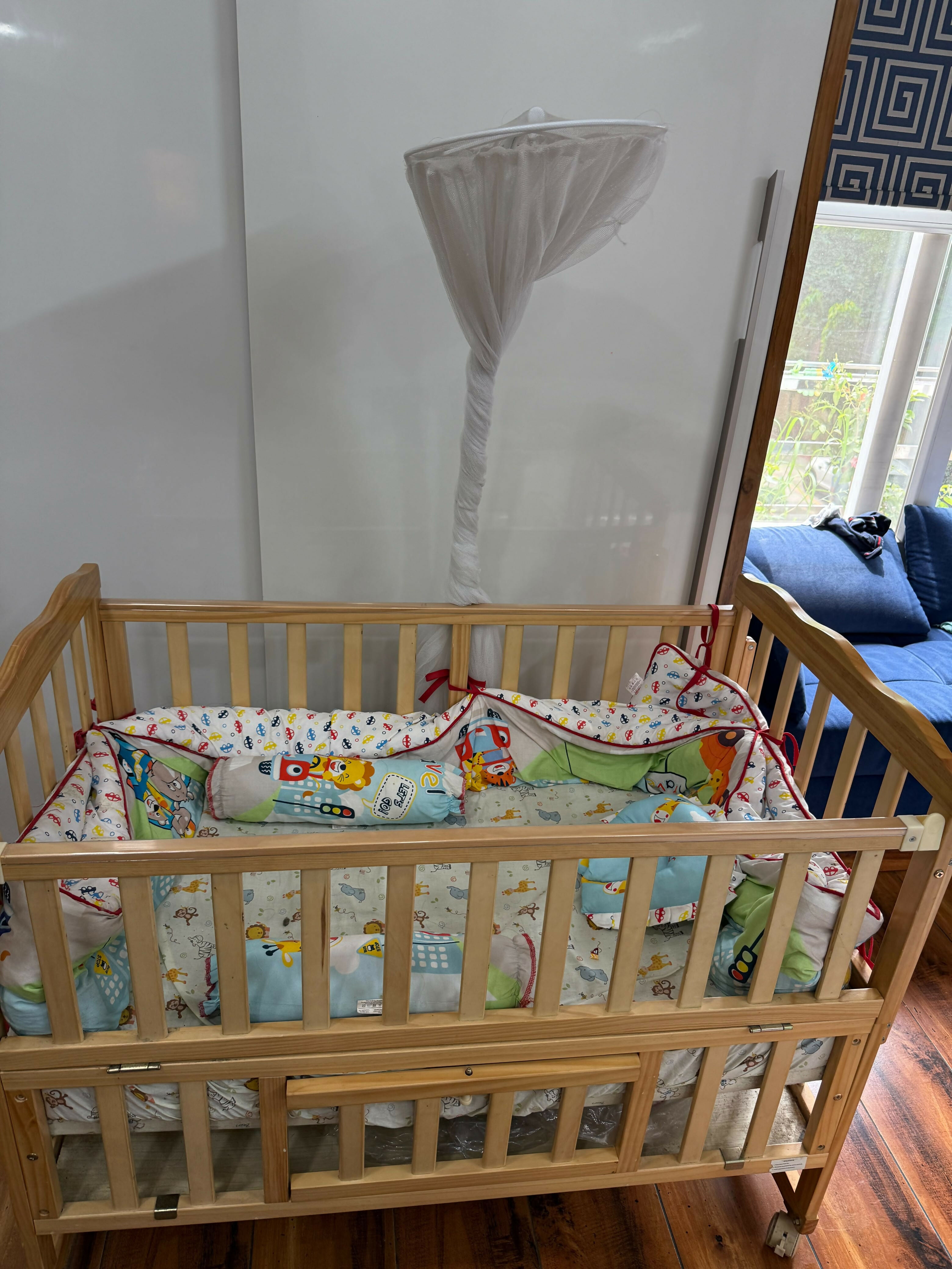 BABYHUG Baby Cot Cum Rocker with Mattress in Some Used condition featuring a versatile cot and rocking design, comfortable mattress, sturdy frame, and protective side rails for baby's everyday rest and relaxation.