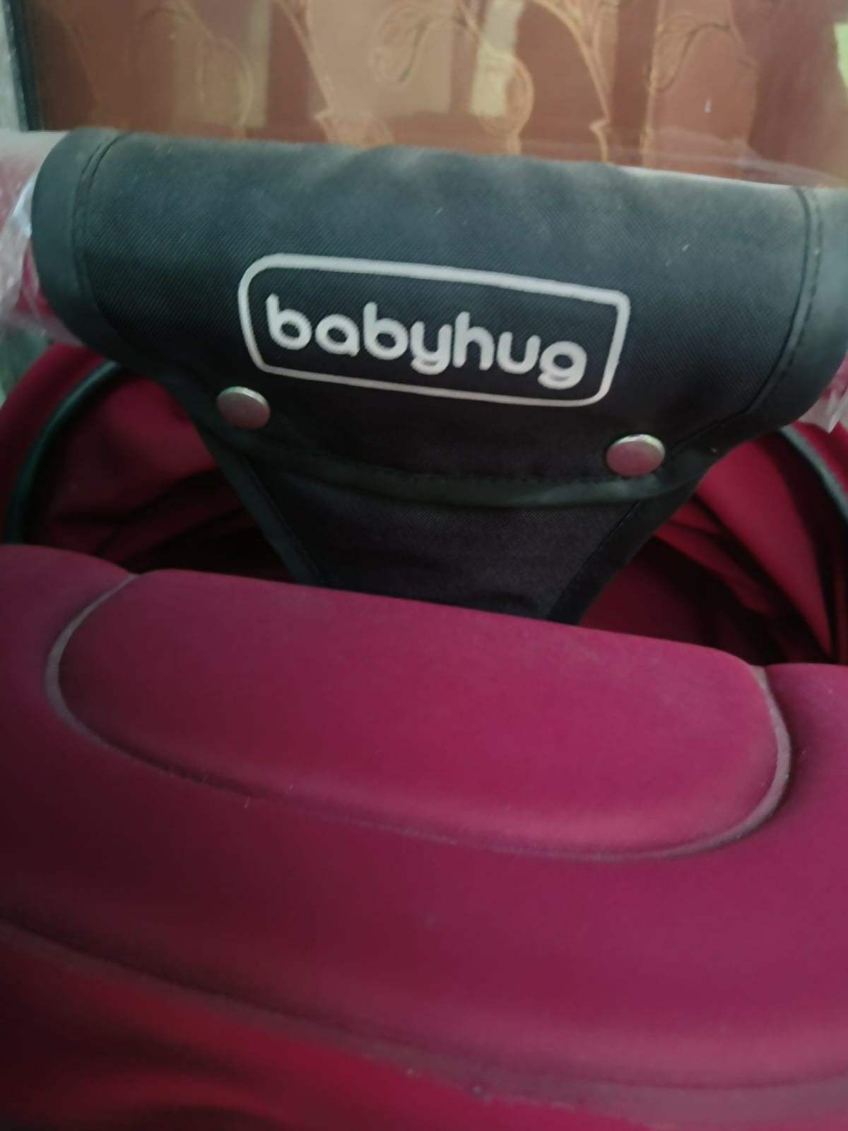 Babyhug stroller/pram with a reclining seat, 5-point safety harness, adjustable canopy, smooth wheels, spacious storage basket, and a lightweight foldable design for comfortable everyday travel.