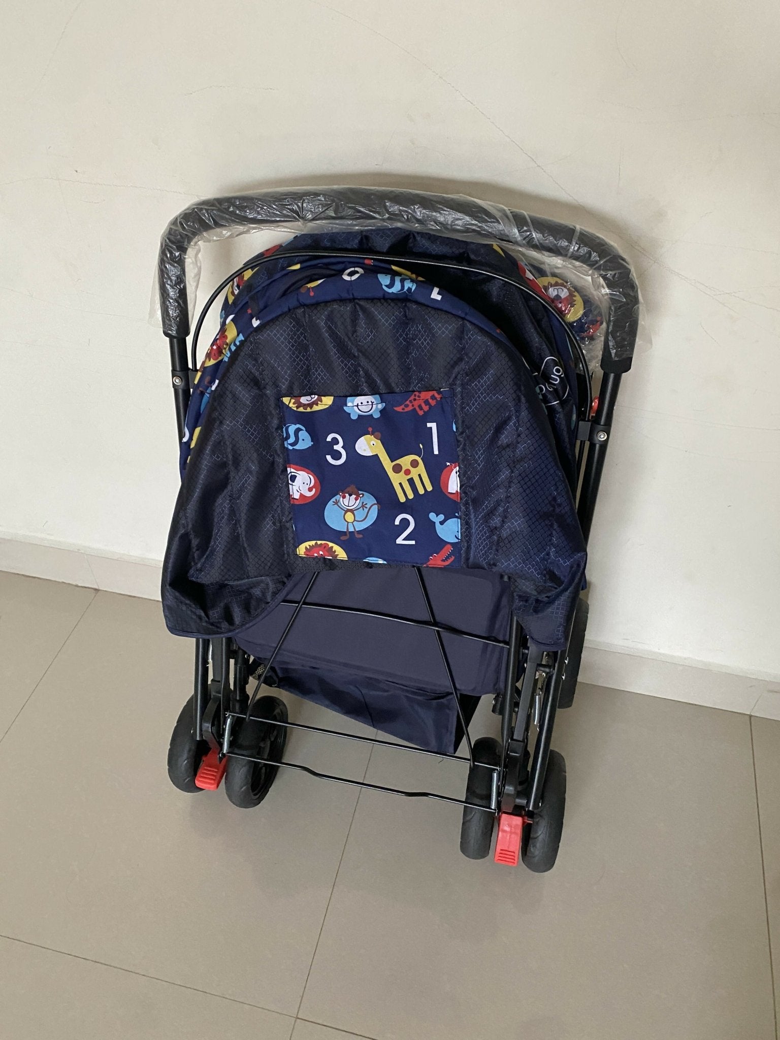Babyhug Baby Stroller with a lightweight foldable frame, reclining seat, adjustable canopy, safety harness, smooth wheels, and storage basket for comfortable everyday outings with babies and toddlers.