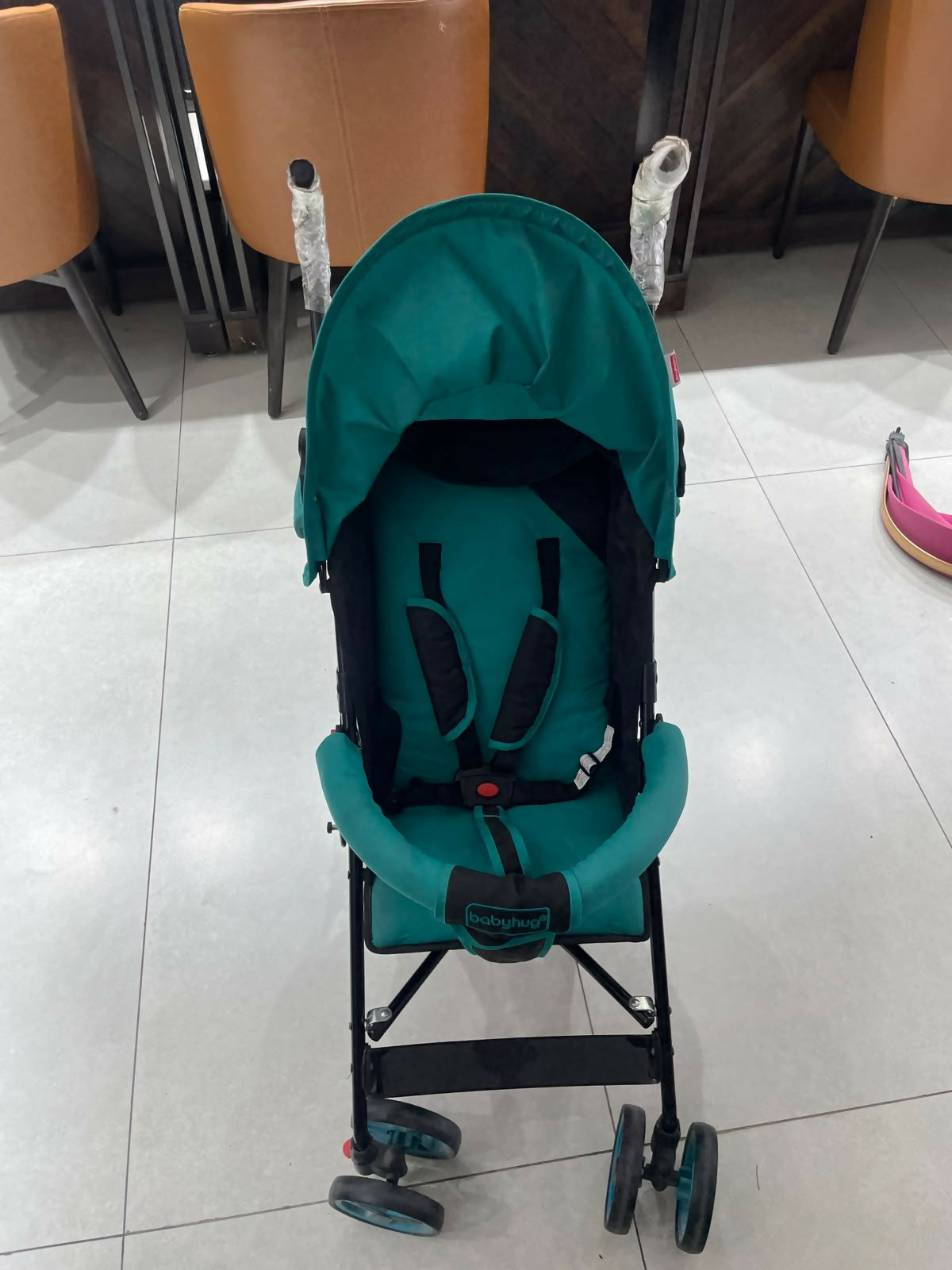 BABYHUG Agile Lightweight Baby Stroller in Blue & Black, Preloved New condition, featuring compact umbrella fold, adjustable canopy, rear wheel brakes, front swivel wheels, and a travel-friendly design for convenient outings.