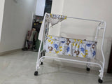 Babyhug Cradle with a sturdy frame, gentle rocking function, comfortable sleeping space, breathable design, and secure construction to provide a cozy resting place for newborns and infants.
