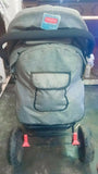 Babyhug Melody stroller with a reversible handle, adjustable canopy, reclining seat, 5-point safety harness, smooth wheels, and a lightweight foldable design for comfortable everyday travel.