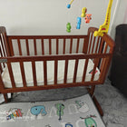 BABYHUG Joy Baby Cradle with Mattress for comfortable rest and gentle rocking.