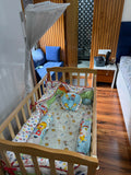 BABYHUG Baby Cot Cum Rocker with Mattress in Some Used condition featuring a versatile cot and rocking design, comfortable mattress, sturdy frame, and protective side rails for baby's everyday rest and relaxation.