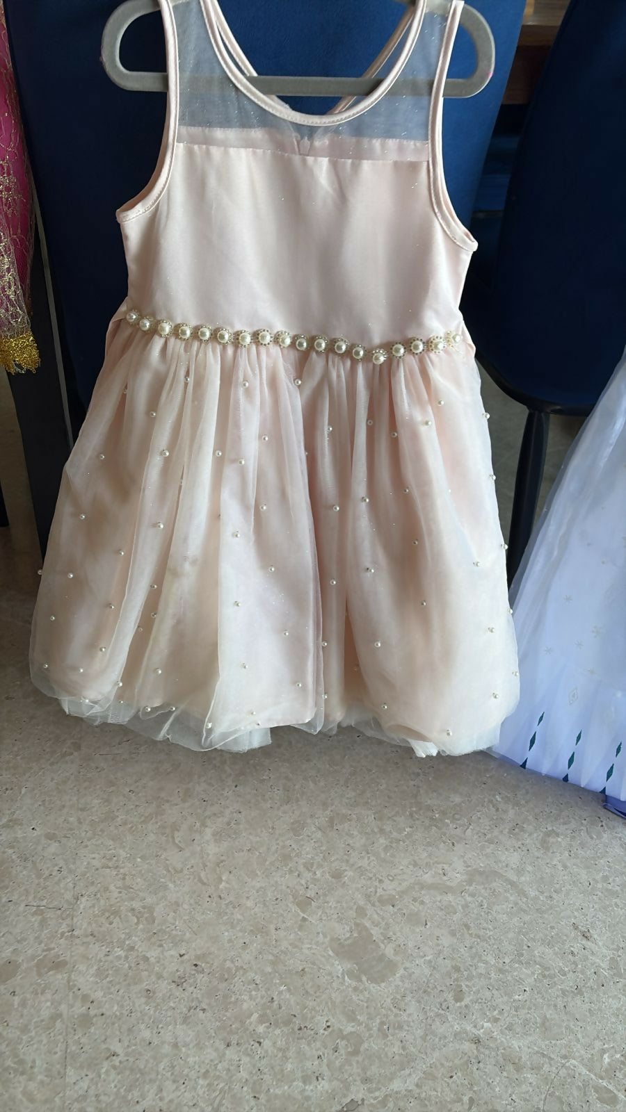 Beige partywear dress for girls featuring elegant styling, soft fabric, comfortable fit, and a charming look for birthdays, celebrations, weddings, and special occasions.