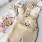 Knitted baby overalls with matching booties and headband 
