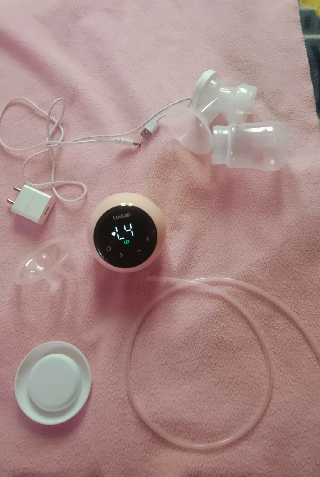 LUVLAP Adore Electric Breast Pump with adjustable suction levels, multiple pumping modes, soft silicone breast cushion, compact design, and easy-to-use controls for comfortable and convenient milk expression.