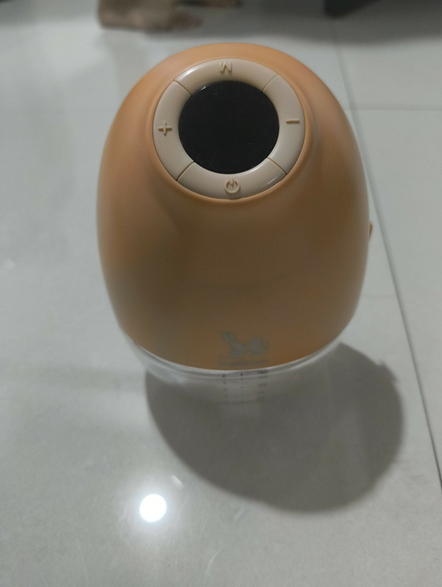 Bump2Cradle Wearable Hands-Free Breast Pump with travel case, featuring a hands-free wearable design, adjustable suction levels, rechargeable battery, quiet operation, and BPA-free components. Like new, barely used.