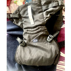 Chicco baby carrier with ergonomic design, padded shoulder straps, adjustable waist support, secure buckles, and multiple carrying positions for comfortable babywearing.