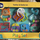CHICCO teether and rattle play set with 4 pieces featuring baby-safe materials, textured teethers, colorful rattles, and engaging toys for teething relief and sensory development.