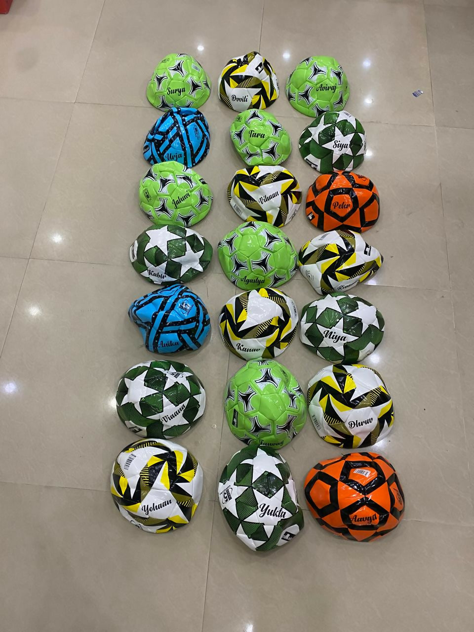 Customized size 5 football with child’s name printed, available in random colors with theme-based personalization options.