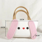 Small bag with pink bunny ears and measurements on a white background