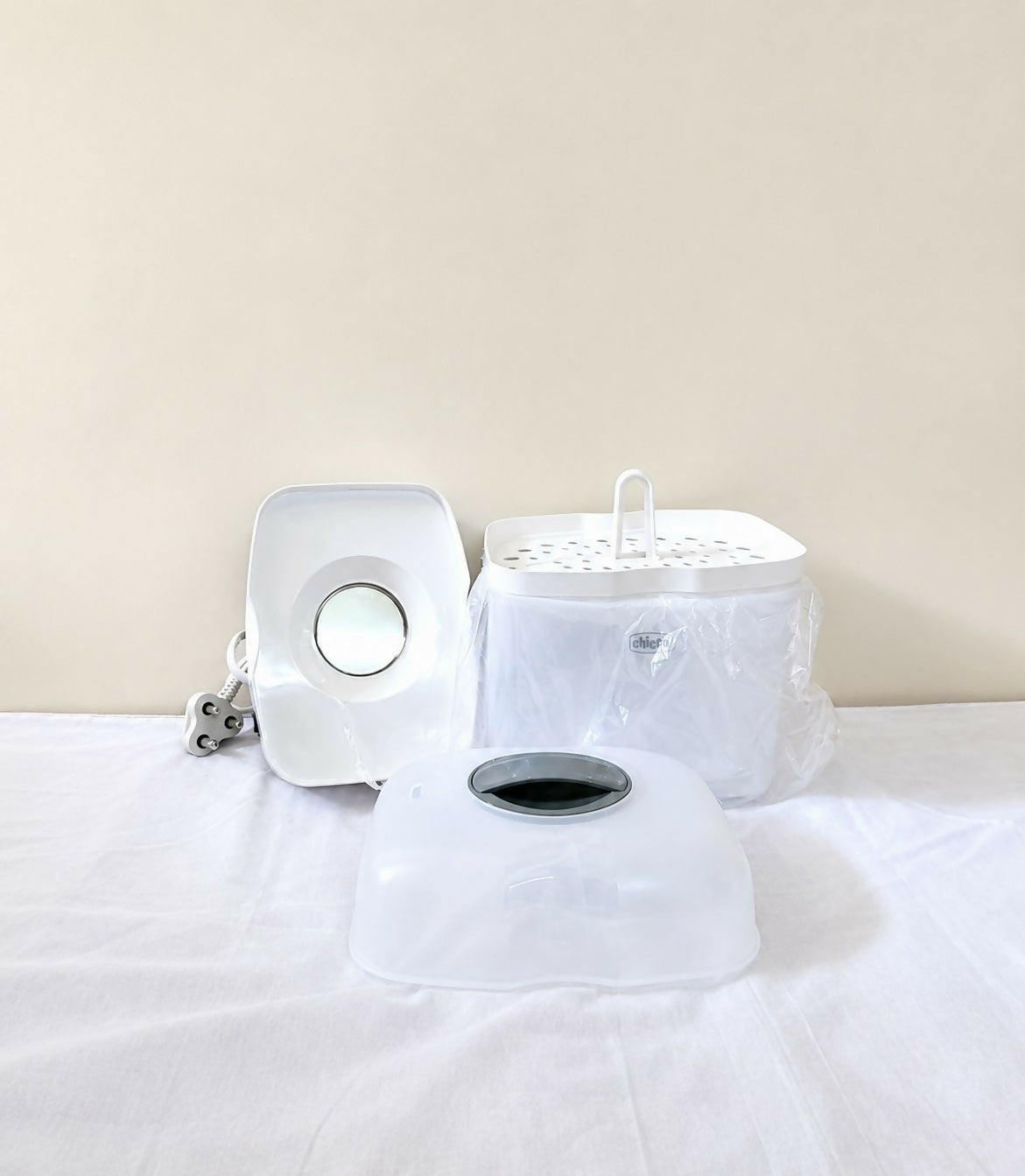 Chicco SterilNatural 2 in 1 electric steam steriliser for baby bottles and feeding accessories with efficient steam sterilization, compact design, and convenient hygiene support for baby essentials.