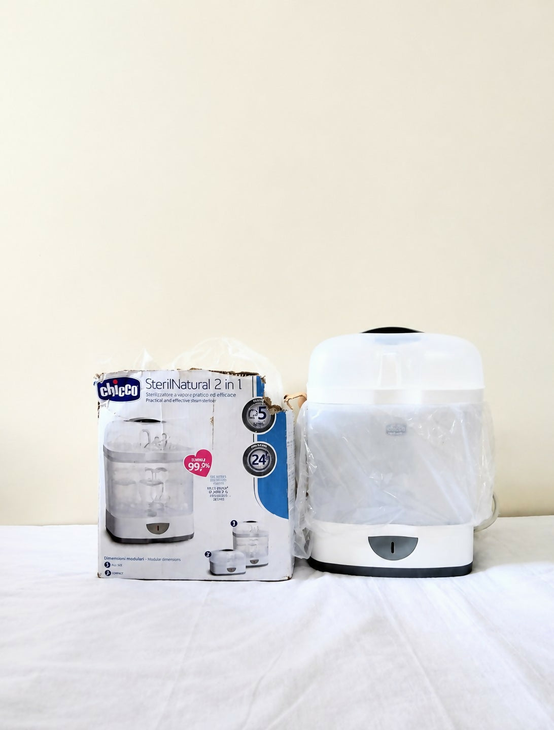 Chicco SterilNatural 2 in 1 electric steam steriliser for baby bottles and feeding accessories with efficient steam sterilization, compact design, and convenient hygiene support for baby essentials.
