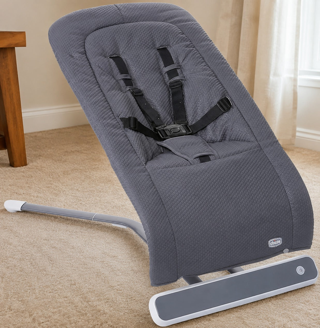 CHICCO Rhythm N Sound Baby Electric Swing with gentle automatic swinging, adjustable speed settings, soothing melodies, padded seat, safety harness, and sturdy frame for relaxing and comforting babies.