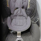 Child Car Seat with padded seating and safety harness for comfortable car travel.