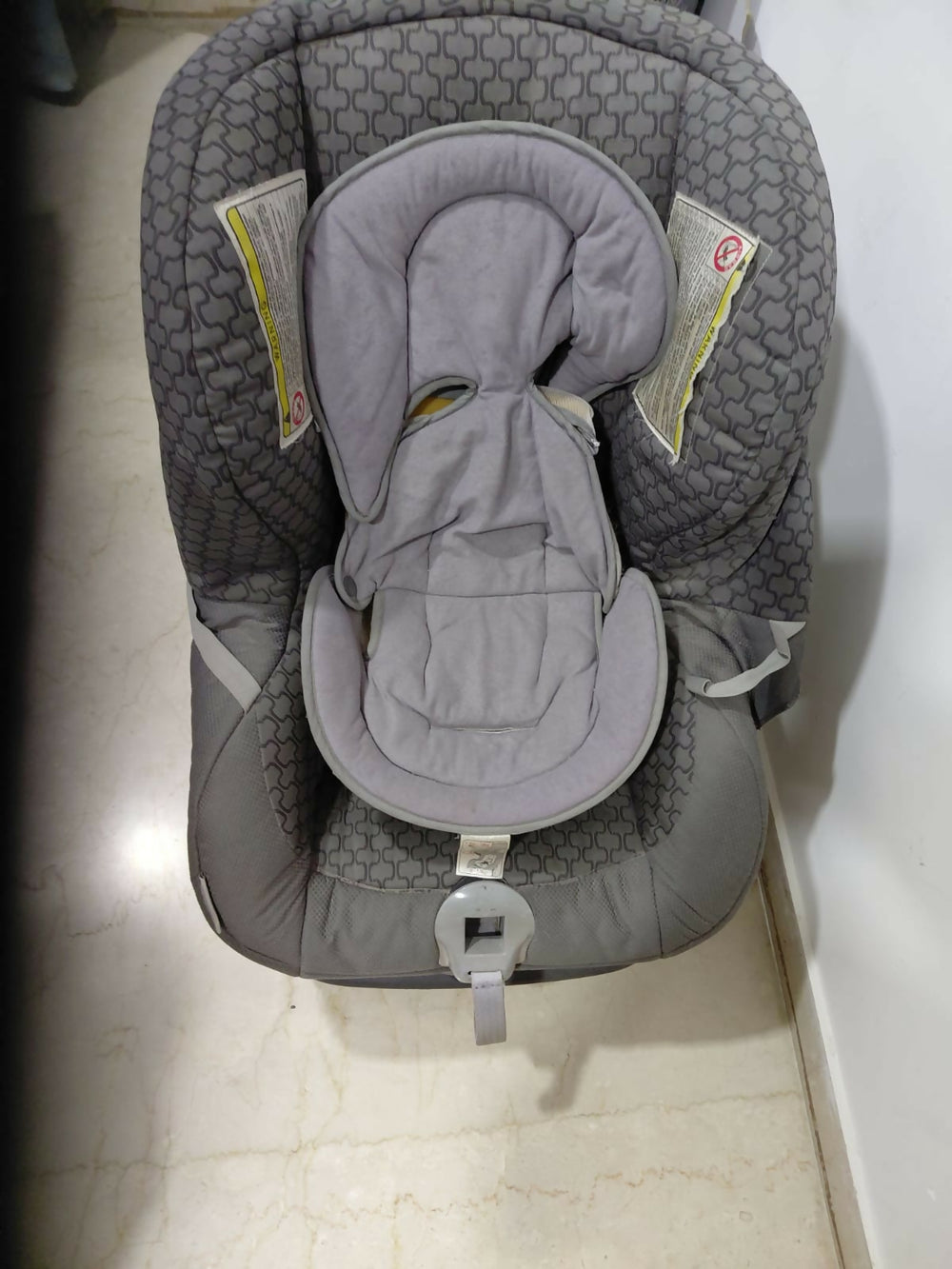 Child Car Seat with padded seating and safety harness for comfortable car travel.