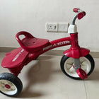 RADIO FLYER tricycle with sturdy construction, comfortable seat, easy-grip handlebars, smooth wheels, and child-friendly design for outdoor play and riding adventures.