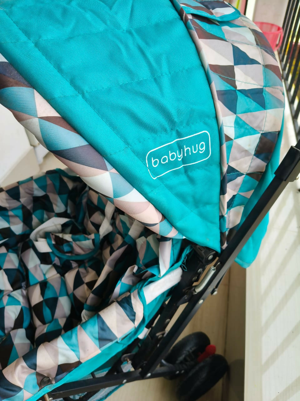 BABYHUG Cocoon Blue stroller with reclining seat, smooth wheels, safety harness, adjustable canopy, and comfortable travel design for babies and toddlers.