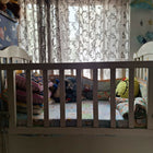Wooden baby crib with storage, mattress, and bumper featuring sturdy wooden construction, spacious sleeping area, built-in storage, protective bumpers, and comfortable support for babies.