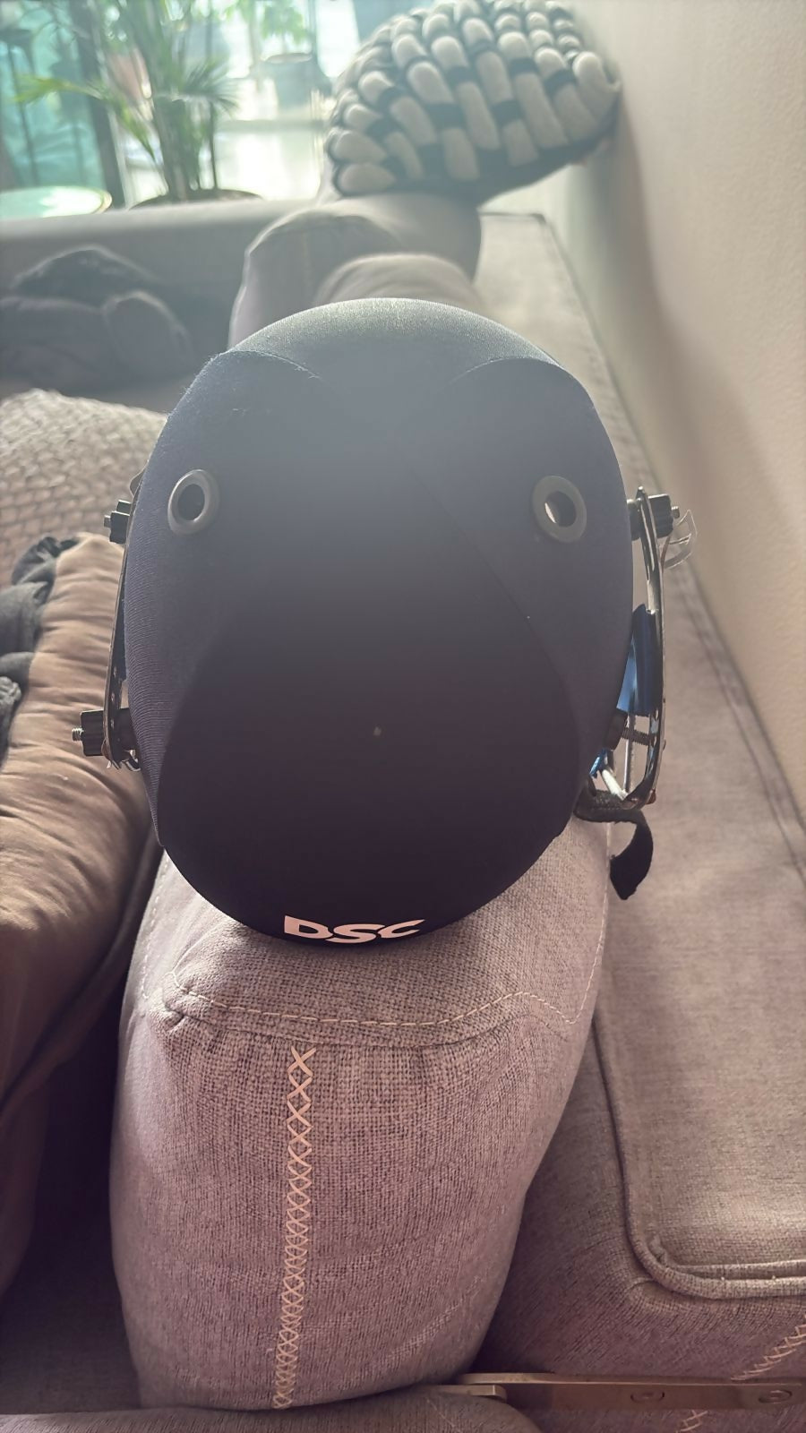 Cricket safety helmet and cricket cap designed for young players with protective construction, comfortable fit, adjustable support, and sporty styling for practice sessions and matches.