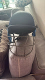 Cricket safety helmet and cricket cap designed for young players with protective construction, comfortable fit, adjustable support, and sporty styling for practice sessions and matches.