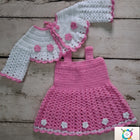 Handmade Crochet Baby Frock with delicate knitted detailing for baby girls.