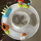 Skip Hop Play Gym with a soft padded play mat, hanging developmental toys, baby-safe mirror, and interactive activities to encourage tummy time, sensory exploration, and early development.