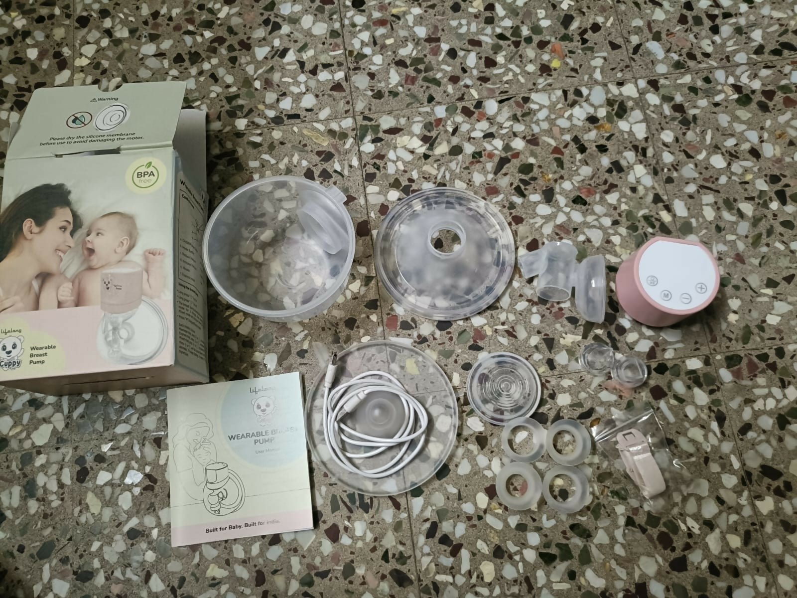 Lifelong Cuppy wearable breast pump with hands-free design, adjustable suction levels, lightweight collection cups, and rechargeable operation for comfortable and discreet milk expression.