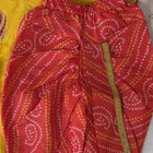 Red patterned fabric with a yellow background