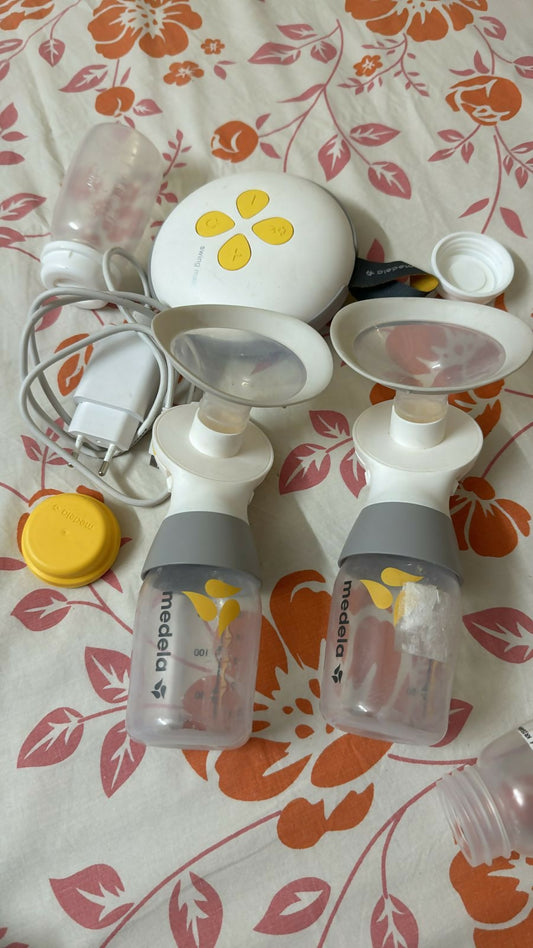 Enhance your breastfeeding experience with the MEDELA Swing Maxi Double Electric Breast Pump – featuring 2-Phase Expression technology, portable design, and adjustable comfort for efficient, convenient pumping.