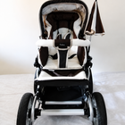 Emmaljunga City Cross Premium Stroller B128 in Almost New condition, available in Chennai, Tamil Nadu, featuring a reversible seat, comfortable reclining design, protective canopy, rain cover, sturdy frame, and smooth wheels.