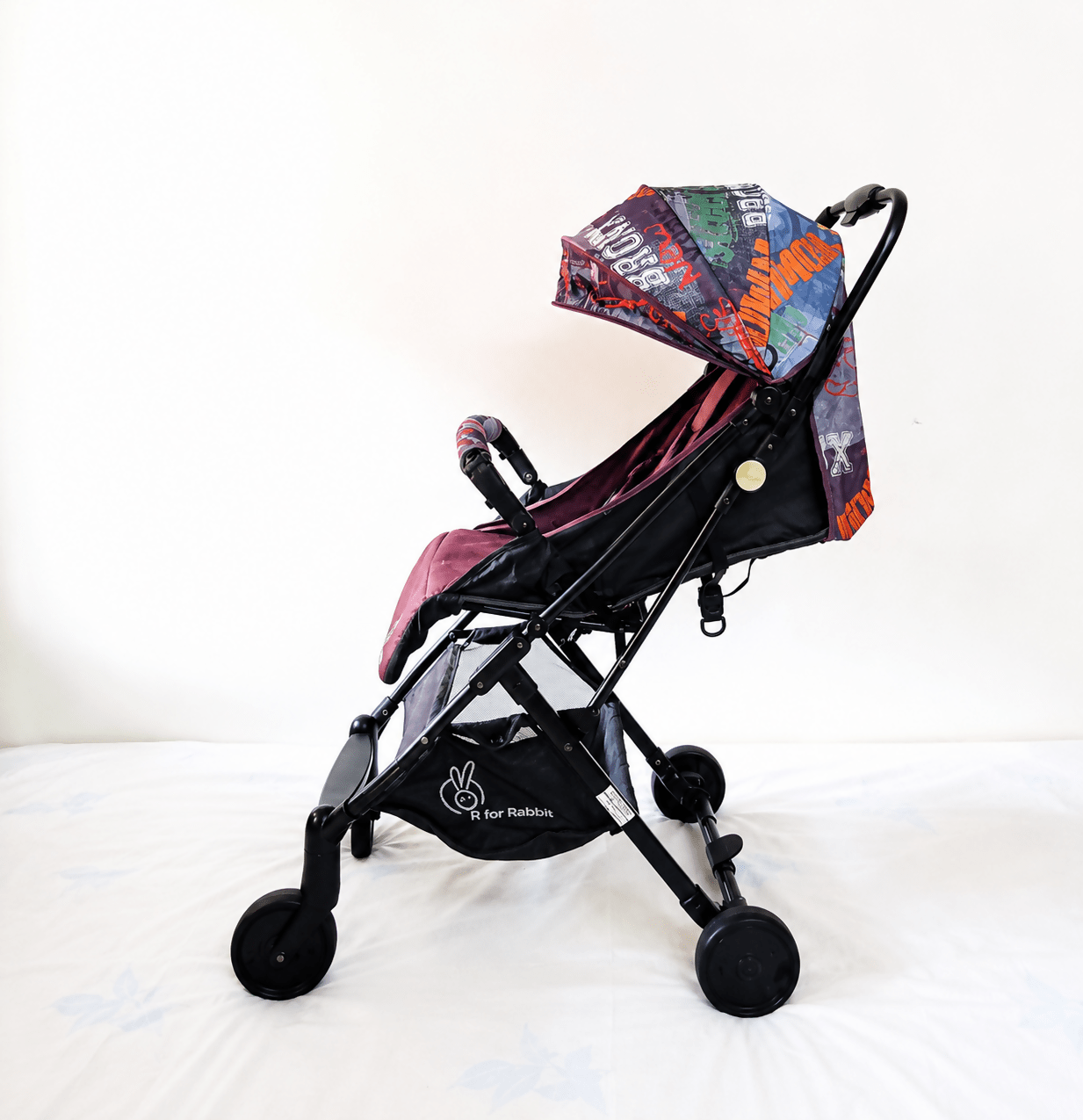 R for Rabbit Pocket Lite baby stroller with lightweight foldable design, reclining seat, adjustable canopy, 5-point safety harness, smooth wheels, and compact travel-friendly frame for babies and toddlers up to 15 kg.