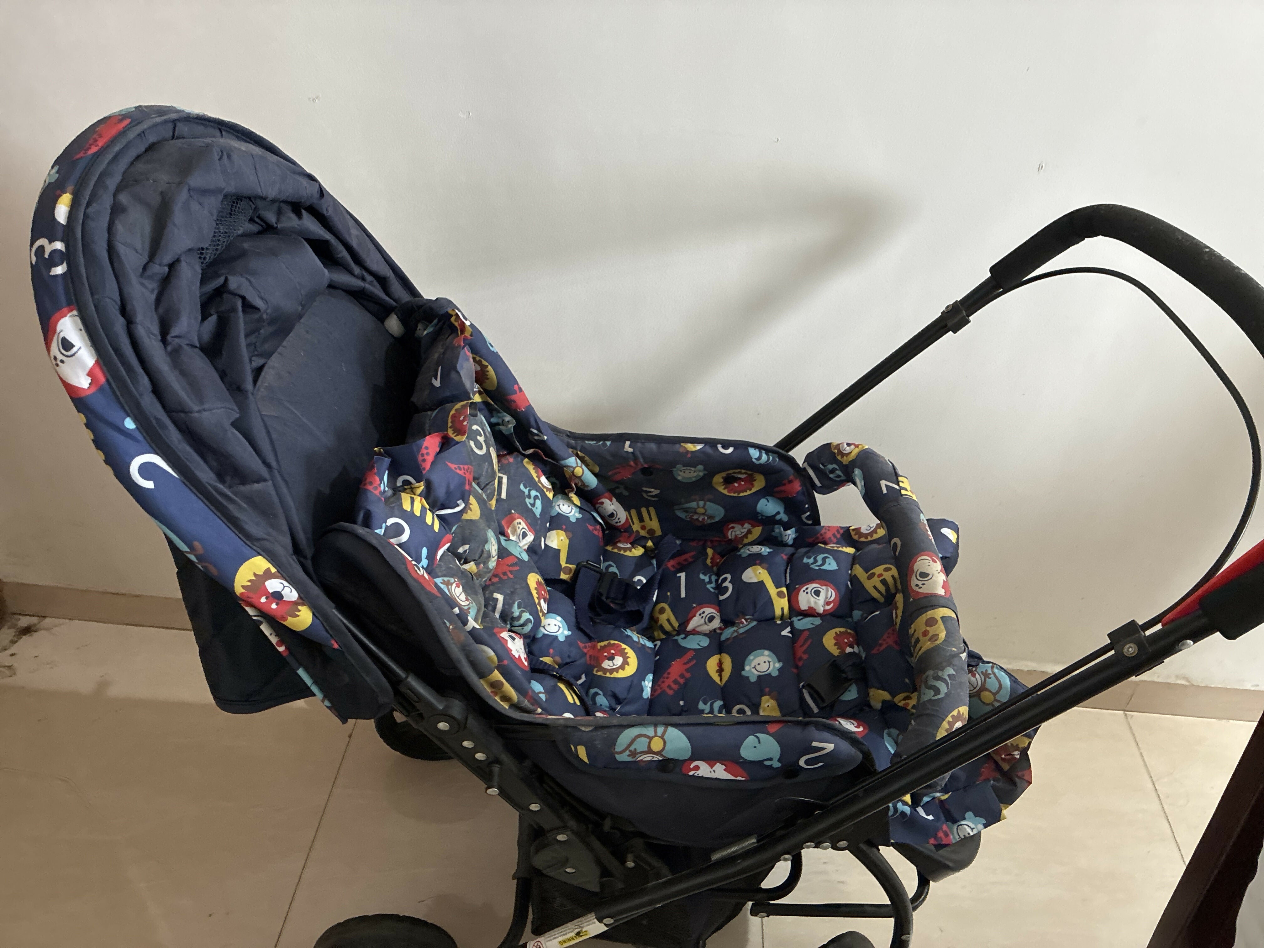 Babyhug Cosy Cosmo Stroller with a lightweight foldable frame, reclining seat, adjustable canopy, 5-point safety harness, smooth wheels, and spacious storage basket for safe and comfortable travel with babies and toddlers.