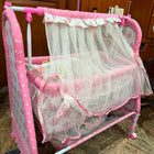 Fab N Funky Manual Cradle with a sturdy frame, gentle manual rocking motion, comfortable sleeping area, breathable design, and secure construction to provide a cozy resting space for newborns and infants.