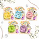 iLearnngrow Pop It Rakhi Combo featuring a colorful fidget-style Pop It Rakhi and festive gift elements, designed as a fun and playful Raksha Bandhan gift for kids.
