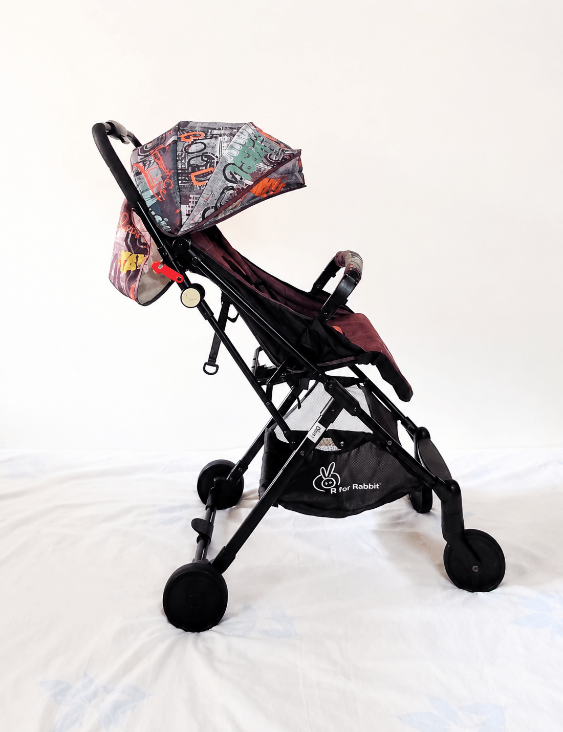 R for Rabbit Pocket Lite baby stroller with lightweight foldable design, reclining seat, adjustable canopy, 5-point safety harness, smooth wheels, and compact travel-friendly frame for babies and toddlers up to 15 kg.